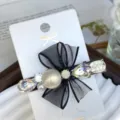 Black mesh bow hairpin with sparkling rhinestones and large pearl, elegant side clip. - Large Pearl Teardrop in Iridescent White