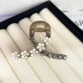 Elegant camellia hair claw clip with sparkling rhinestones, perfect for half up hairstyles. - 6CM Hanger Style / Gray
