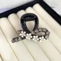 Elegant black hair claw clip with white flower and crystal rhinestones, chic small shark clip for women. - Ribbon Style / Black
