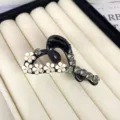 Elegant black camellia hair claw clip with white flowers and grey rhinestones for half-up hair styles. - Slanted Heart Style / Black