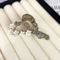 Elegant camellia hair claw clip with rhinestones, stylish heart-shaped hair accessory for women. - Slanted Heart Style / Gray