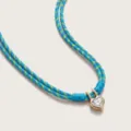 Close-up of heart zircon pendant on blue braided rope necklace, detailed vintage jewelry piece. - Blue Cord Heart Double-Layer Necklaces / Blue