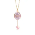 Detail shot of gold-plated oval locket necklace with enamel purple flower and cute pink cat charm. - Bowknot Opening Cat Necklaces