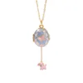 Close-up detail of the exquisite enamel egg locket necklace with a cute pink puppy pendant. - Blue Bowknot Opening Dog Necklaces