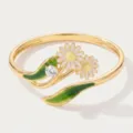 Close-up of gold-plated daisy ring featuring enamel flowers, green leaves and sparkling CZ stone. - Open Style / April Birth Flower Rings