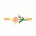 Detail view of gold-plated enamel daisy cuff bracelet with sparkling crystal center. - Light Pink Sunflower