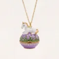 Close-up of gold-plated unicorn egg pendant necklace, featuring sparkling rhinestones. - Purple Unicorn and Grass Locket Necklaces