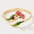 Gold plated open ring featuring red enamel flower and green leaf design with gemstone. - Open Style / January Birth Flower Rings