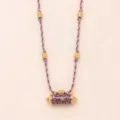 Detailed view of purple braided rope necklace featuring gold electroplated cylindrical pendant and beads. - Scorpion