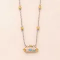 Fashionable pink braided rope necklace with golden beads and enameled cylindrical pendant. - Swan