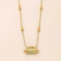 Detailed shot of gold plated braided rope necklace featuring a cylindrical butterfly pendant. - Butterfly