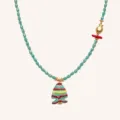 Close-up detail of the blue beaded necklace with a cute striped fish pendant and gold charms. - Green Fish Necklace / Green
