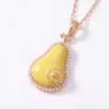Close up detail of pear shaped pendant necklace with pearl edging and yellow enamel finish. - Pear Locket Style / 45+5cm