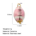 Hand-painted ceramic rugby bead oval jewelry accessory with stainless steel components. - Pink