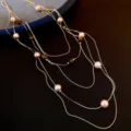 Detailed view of the multi-layer beaded pearl and tiger's eye necklace for stylish women. - Necklace-Gold-Brown
