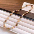 Retro Maillard tiger eye pearl beaded bracelet detail shot, elegant mixed gemstone fashion jewelry piece. - Necklace-Coffee