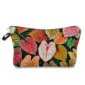 Detailed view of a stylish women's cosmetic bag featuring vibrant tropical green leaf pattern. - Tropical Green Leaves Style (hzk2422)