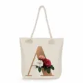 Detailed view of canvas tote bag with gold letter A print and elegant floral roses. - Golden Letter A Print Style