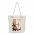 Canvas tote bag with gold letter E print and floral design, casual shoulder bag for daily use. - Golden Letter E Print Style