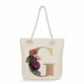 Canvas tote bag with elegant golden letter G print and floral design, large capacity shoulder bag. - Golden Letter G Print Style