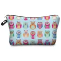 Close-up detail of the vibrant colorful owl pattern printed on the travel cosmetic pouch. - 306-20