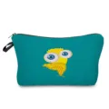 Detailed view of the turquoise travel makeup bag featuring a unique yellow owl cartoon print. - hz0005