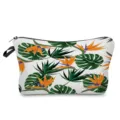 Detail view of a stylish tropical leaf print cosmetic bag with secure zipper closure. - Bird of Paradise White Base (hz0317)