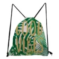 Detailed view of green tropical leaf printed drawstring backpack with gold text design. - Good Vibes Print Style (sk4776)