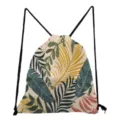 Tropical leaf print drawstring backpack detail showcasing vibrant botanical pattern and black cords. - Beige Tropical Leaf Style (sk4777)