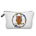 Detailed view of the colorful owl printed cosmetic bag, showing fine zipper and fabric. - hz0380