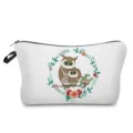 Detail view of portable travel cosmetic bag featuring cute owl and floral print design. - hz0382