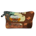 Detailed view of the cute autumn owl print cosmetic bag, featuring durable zipper and fabric tab. - hz0437