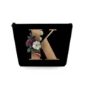 Zwarte cosmetische tas met bloemige letter K, draagbare make-uptas voor stijlvolle lippenstift. - Hoofdletter K Stijl