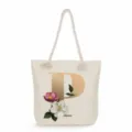 Beige canvas tote bag with gold letter P and floral print, casual shoulder bag for women. - Golden Letter P Print Style