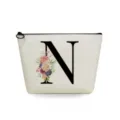 Canvas makeup bag featuring letter N and watercolor floral print for daily cosmetic storage. - Letter N Style