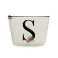 Canvas makeup bag with floral letter S print, ideal for travel, toiletry and cosmetic storage. - Letter S Style
