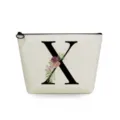 Canvas cosmetic bag detail showing large letter X print and floral watercolor decoration. - Letter X Style
