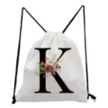 White monogram letter K drawstring backpack with watercolor floral print for daily casual use. - Letter K Style
