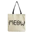 Detailed view of canvas tote bag with cute cat letter print and black handles for daily casual use. - Meow Cat Theme Art Letter Print(hm3340)