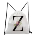 White canvas drawstring backpack featuring a floral letter Z print, casual student bag. - Letter Z Style