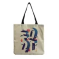 Close-up detail of the stylish canvas tote bag with artistic graphic print and sturdy black handles. - Blue Purple Gradient 3D Geometric Style (hm0233)