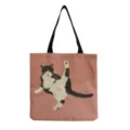 Detailed view of the cute cat print canvas tote bag, perfect for daily shopping and casual use. - Stretching Cat Style (hm3545)