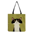 Detailed view of the cute cartoon cat print canvas tote bag, featuring clear stitching and fabric. - Olive Green Big Eye Cat Style (hm3548)