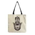 Detailed view of canvas tote bag featuring intricate black and white mandala hamsa hand graphic print. - Hamsa Hand Geometric Print (hm3521)