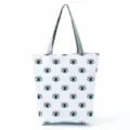 Casual large capacity canvas shoulder tote bag with trendy blue eye print, white background. - Blue And Black Eye Print (hl2694)