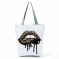 Detailed view of the stylish leopard print lips pattern canvas tote bag with black drip design. - Leopard Lip Print (hl2698)