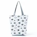Close-up detail of the funny eye pattern print canvas tote bag fabric and texture view. - Full Eye Geometric (hl2706)