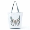 Large capacity canvas tote bag with unique celestial moon eye print, grey handles, stylish. - Mechanical Moon Eye (hl2709)