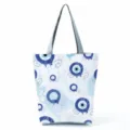 Large capacity canvas tote bag with stylish blue evil eye print, casual shoulder bag for daily use. - Nazar Evil Eye Print (hl2713)