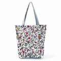 Detailed view of the large capacity casual tote bag featuring a vibrant patterned design. - Colorful Abstract Spotted Eye (hl2717)